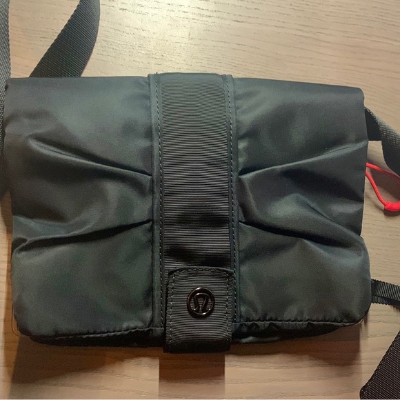 New no tags. Lululemon small Crossbody bag. 4 pockets. Clear phone pocket. - Picture 5 of 5